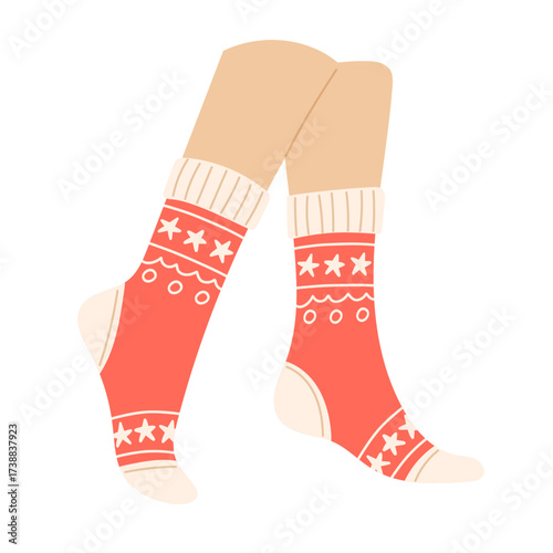 Legs wearing red socks with white star and circle patterns
