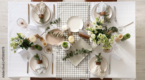 Beautiful table setting with eustoma flowers and eucalyptus for wedding celebration in room, top view