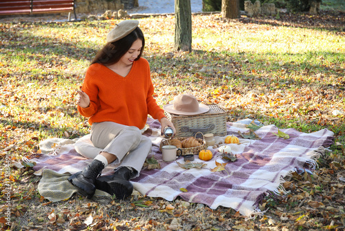Young happy Asian woman wit...