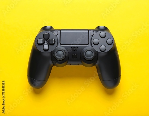 Black Playstation 4 DualShock Controller on a Yellow Background