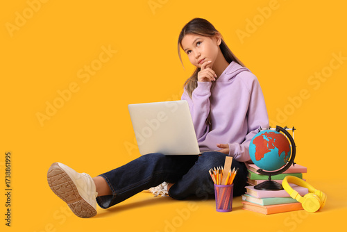 Thoughtful teenage Asian gi...