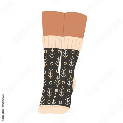 Person wearing kneehigh socks with a tree pattern