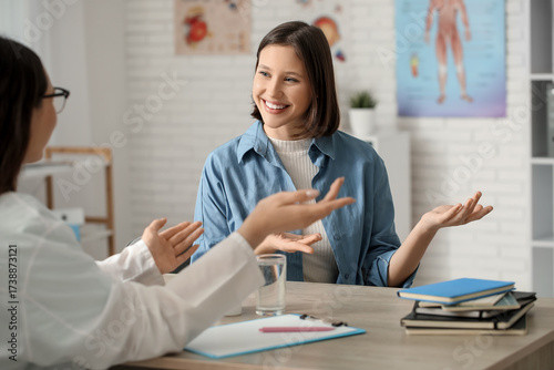 Happy young female doctor w...