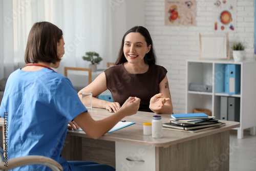 Happy young female doctor w...