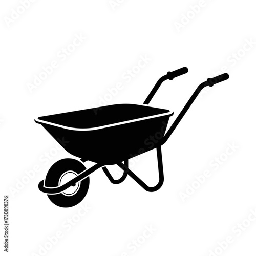Silhouette of a black wheelbarrow against a white backdrop creates graphic contrast