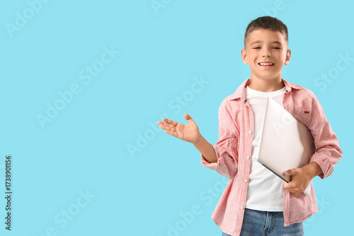 Little boy with laptop on b...