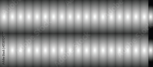 Abstract Geometric Grayscale Design: A minimalist composition of repeating, elongated shapes in varying shades of gray creates a visually striking pattern.