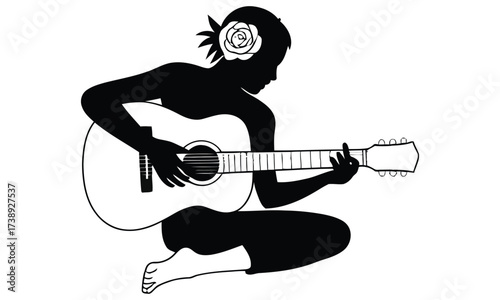 Silhouette of woman playing guitar with flower hair accessory
