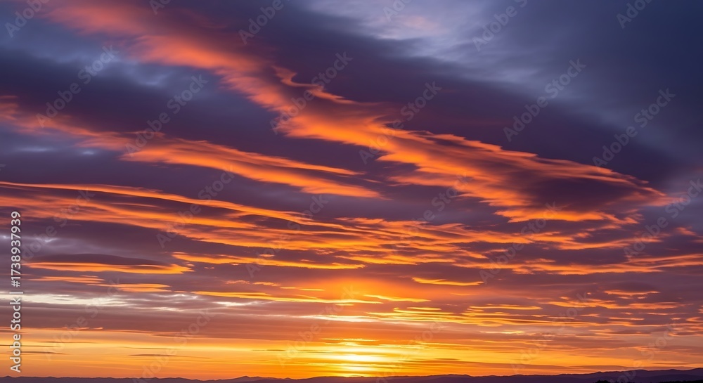 Obraz premium Striking sunset painting the sky with fiery hues and deep twilight shades creating a breathtaking view