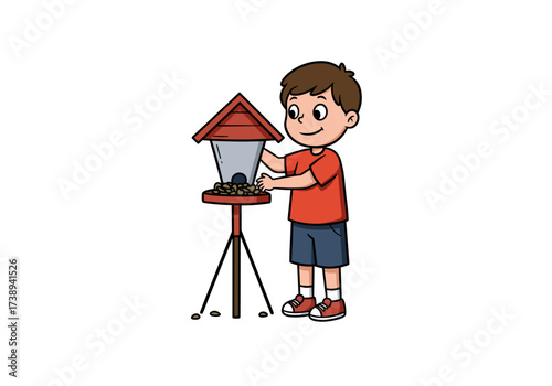 Young boy feeding birds at a bird feeder in a garden  