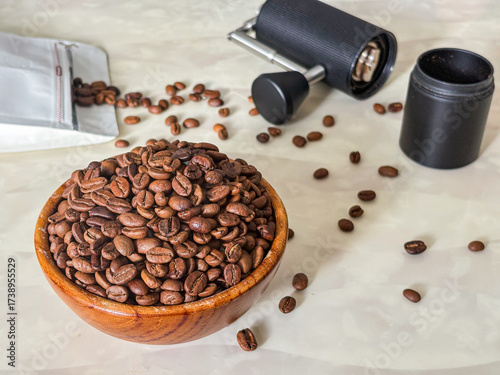 coffee beans in a wooden bowl on a marble table
