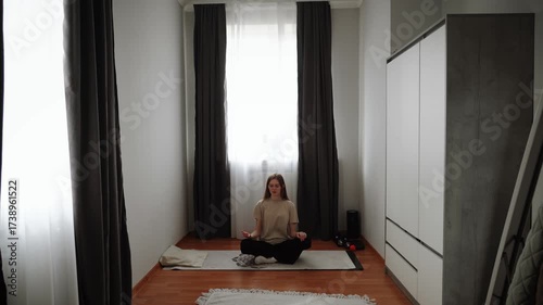 Meditation practice in a serene indoor space with natural light and calming atmosphere