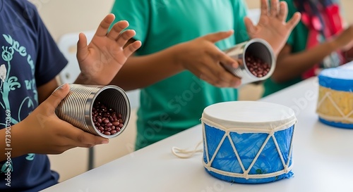 Children playing homemade musical instruments with tin can shakers and drums image