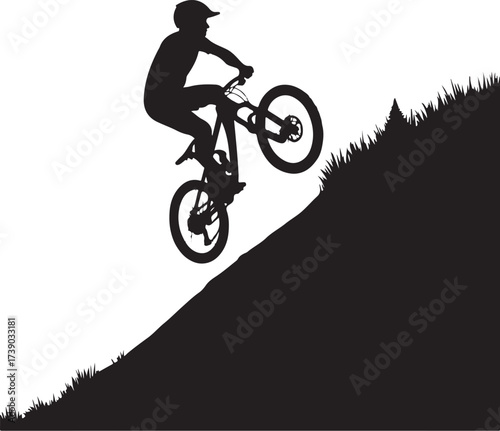 Black silhouette of a mountain biker on a steep grassy slope