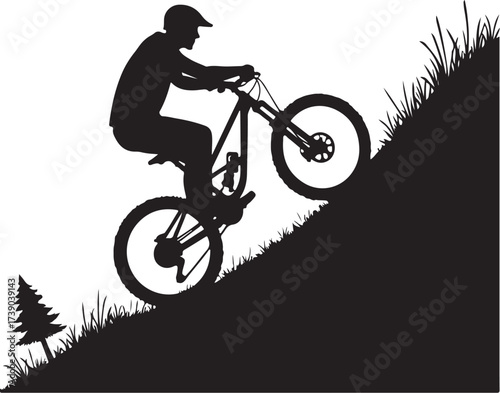 Black silhouette of mountain biker riding uphill on grassy slope