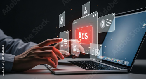 A person's hands interacting with a digital interface displaying advertisements on a laptop screen, representing online advertising and digital marketing strategies.
