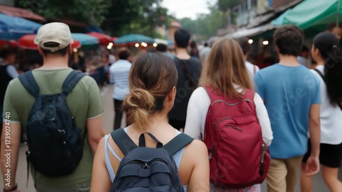 A diverse crowd of young adults walking through bustling market streets, capturing the essence of community, social interaction, and urban exploration in vibrant settings.