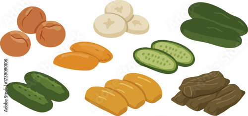 A collection of various food items including whole and sliced cucumbers, bananas, dates, and what appear to be dried plums or prunes.