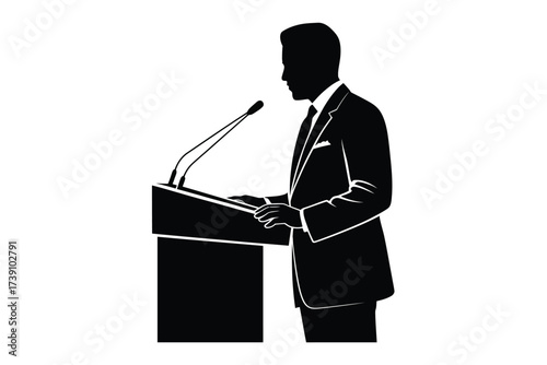 Black silhouette of a man speaking at a podium microphone