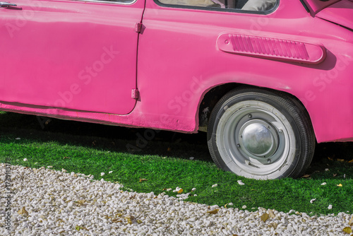 Fragment of an old subcompact car on an autumn day