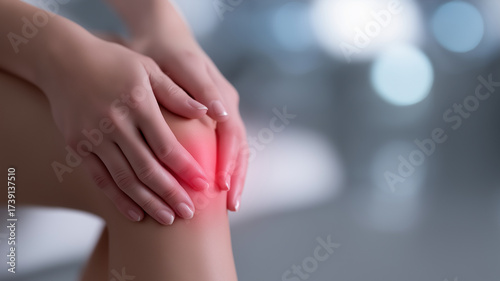 Wallpaper Mural Realistic medical 3D illustration of female hands holding knee with illuminated anatomy view, glowing red inflammation, and blue ligaments symbolizing bone pain, injury, and physiotherapy treatment Torontodigital.ca