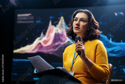 woman is giving a presentation at conference