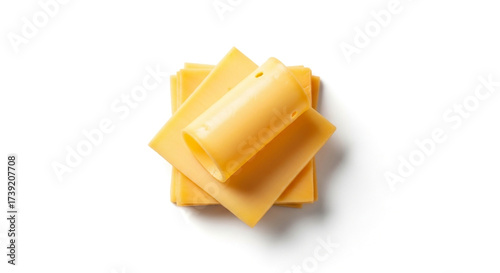 Photo of stack of cheddar cheese slices isolated on white background, top view