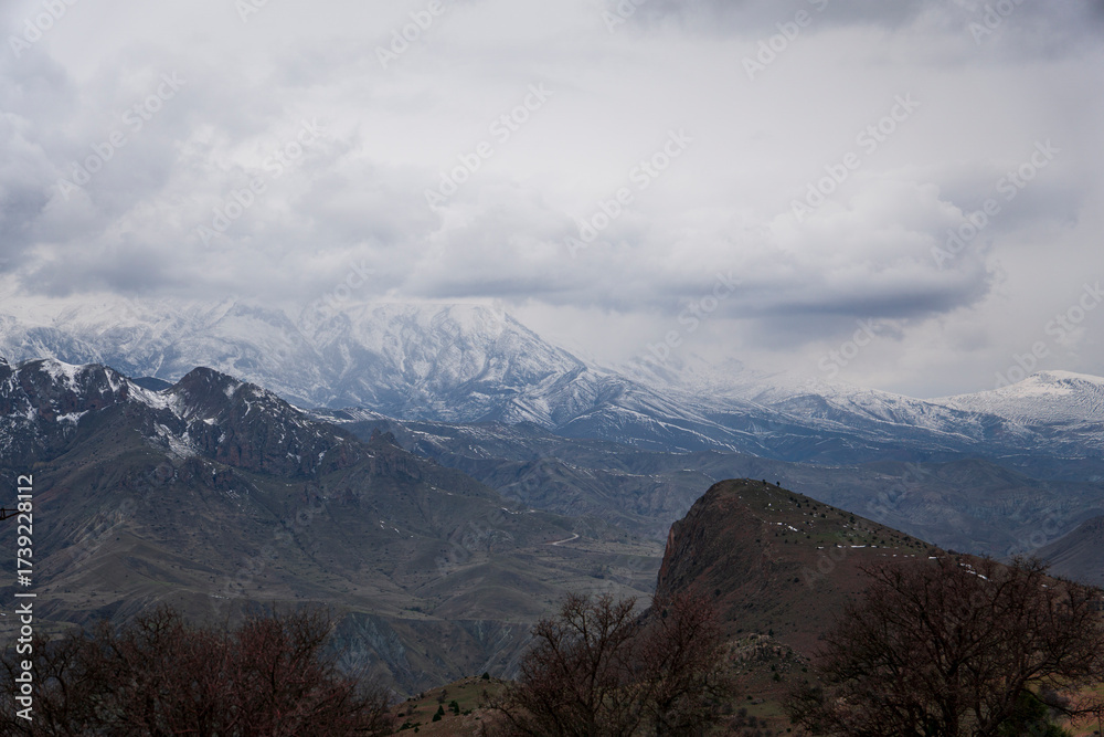 Fototapeta premium Erzincan's snowy and foggy mountain views in spring