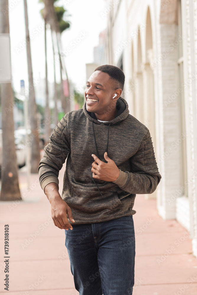 Fototapeta premium Handsome African American man enjoying a sunny autumn day in Miami