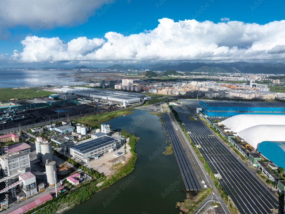 Fototapeta premium Overlooking a cement factory by the seaside.