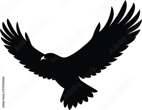 Black vector silhouette of a flying eagle with outstretched wings for a tattoo design or nature illustration