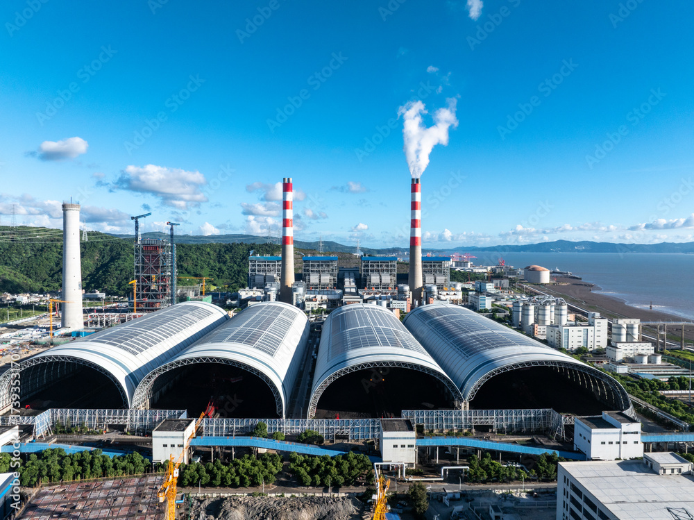 Fototapeta premium aerial view power station under blue sky