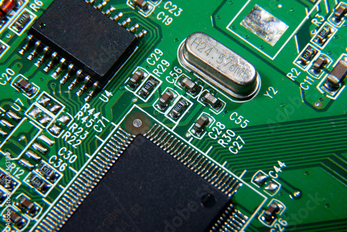 green electronic printed circuit board with assembled radio components