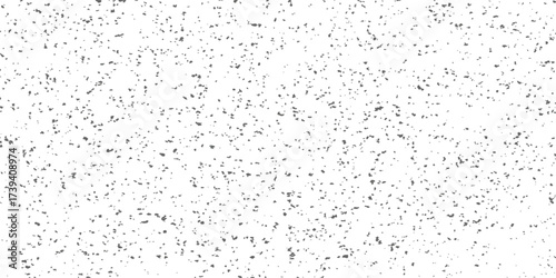 Macro drops of clean water on a glass surface create a textured, abstract pattern in black and white