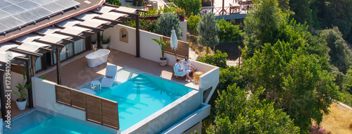 Tableau sur toile Luxury Home with Pool: Capture the essence of lavish living, with a stunning home featuring a pristine pool and breathtaking views, inviting relaxation and elegance