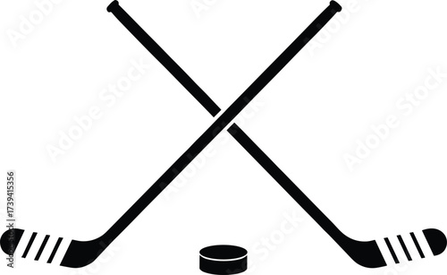 Crossed hockey sticks with puck silhouette, black vector illustration, sports equipment icon, ice hockey symbol, team game concept