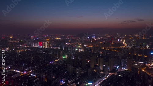 Wallpaper Mural Aerial cityscape at dusk with illuminated buildings and highway networks in wide urban landscape Torontodigital.ca