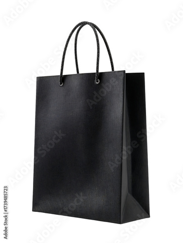 A sleek black paper shopping bag with a subtle texture and glossy black rope handles.