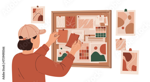 Young woman arranging mood board with abstract art and color swatches.