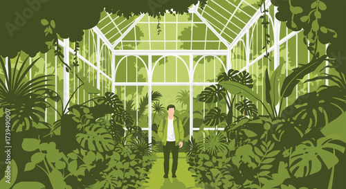 Man Standing Inside Lush Green Greenhouse Surrounded by Plants.