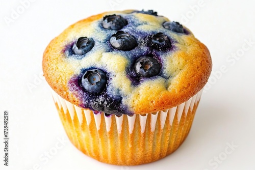 Delicious blueberry muffin with fresh berries on white background