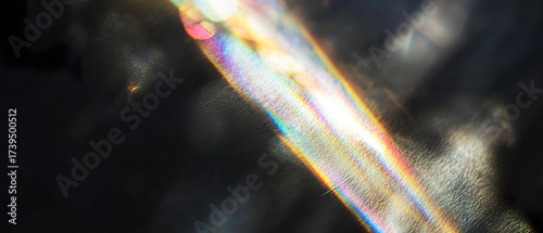 Wallpaper Mural Abstract light refraction with vibrant rainbow streaks on a dark textured background. A dreamy, ethereal visual for creative, tech, or spiritual concepts. Torontodigital.ca