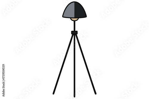 A modern black and white tripod lamp for studio lighting isolated on a white background