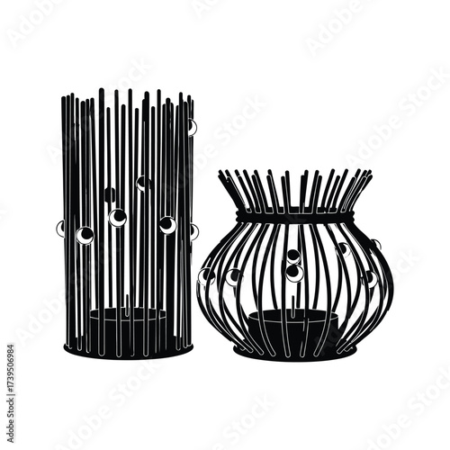 Two decorative black metal candle holders with spherical accents and tea lights on a white background