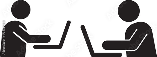 Two people working on laptops silhouette