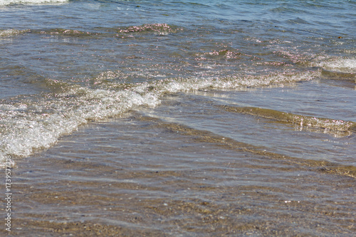 Crossing waves on the seashore surf beach background sunny day