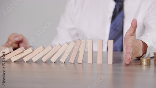 Hand Protecting Domino Blocks Financial Risk Management Protection Concept Business Strategy