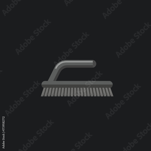 Gray cleaning brush with handle on a dark background.