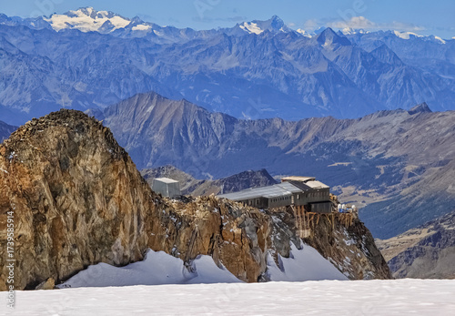 Monte Rosa (Italy) - A mountains view in Valsesia with Monte Rosa mount peak of Alps, alpinistic paths to Rifugio Modena and Capanna Margherita refuge, with snow glacier and alpinists.