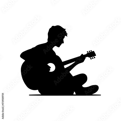 Silhouette of rock musician playing guitar